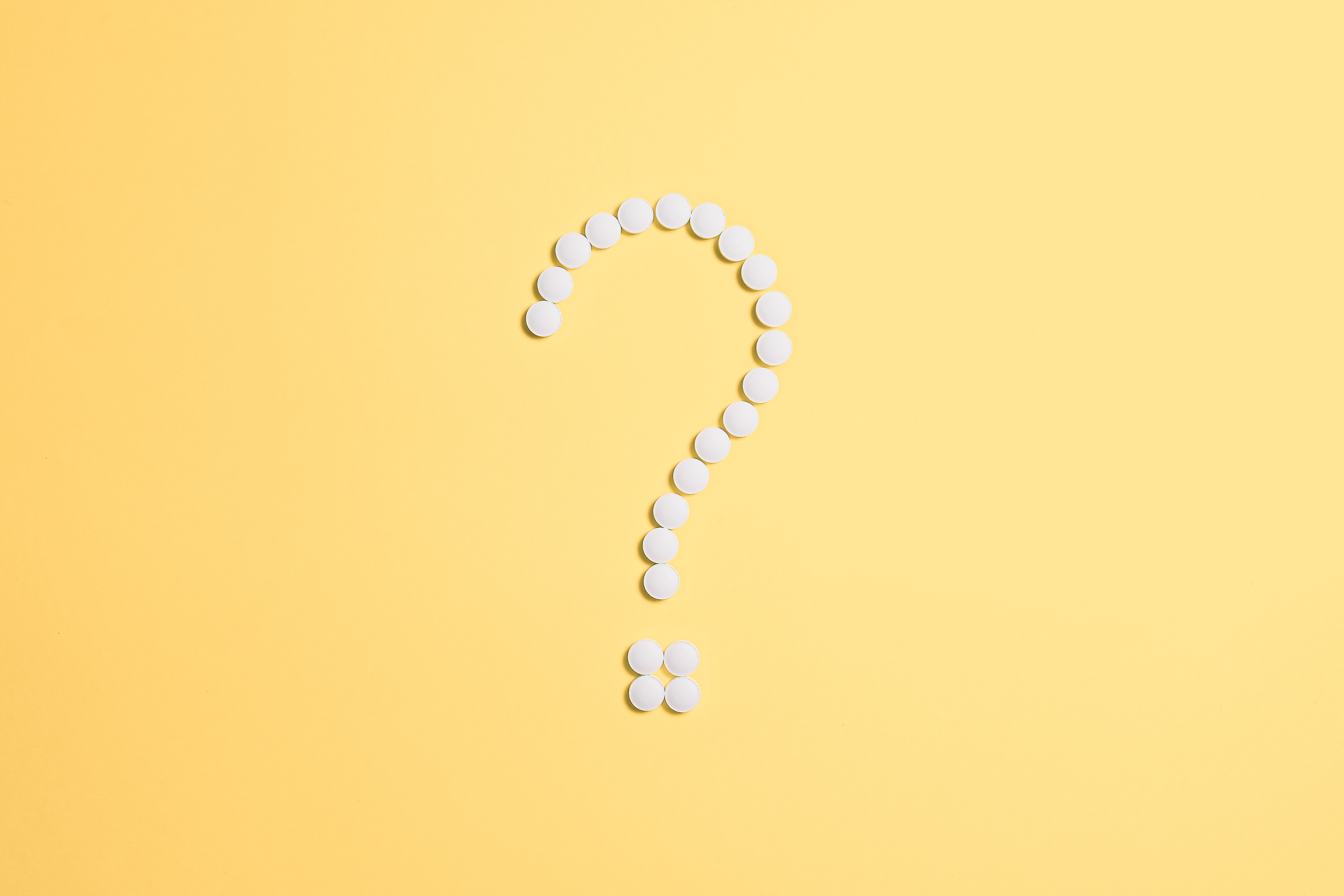 White Beads on Question Mark Sign